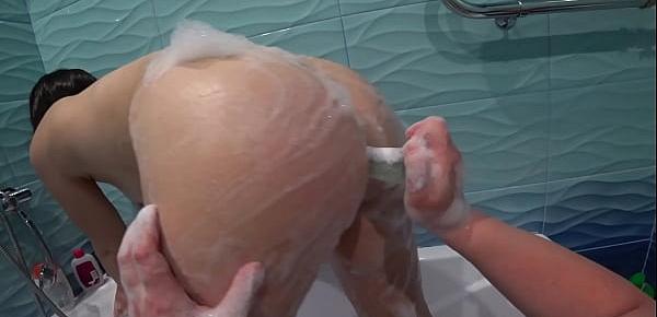  Lesbian spies on a girlfriend in the shower, then washes her big ass and hairy pussy and fucks in anal until orgasm. POV.
